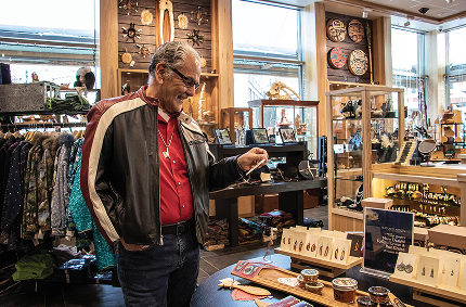 A visitor browsing Alaska Native art in the Sealaska Heritage Store
