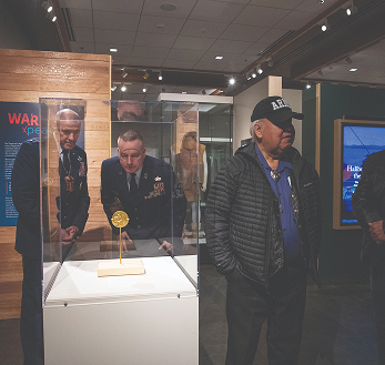 Visitors viewing an exhibit in the Nathan Jackson Gallery