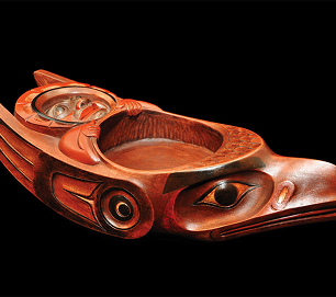 A carved red cedar dish with Northwest Coast formline designs