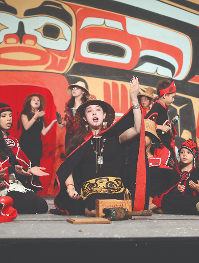 Children and adults performing together at Celebration