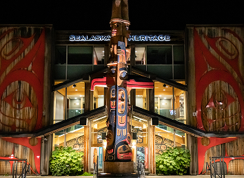 Sealaska Cultural Values Pole illuminated at night