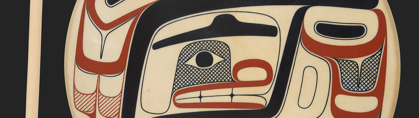 Black and red Northwest Coast formline design painted on an oval panel