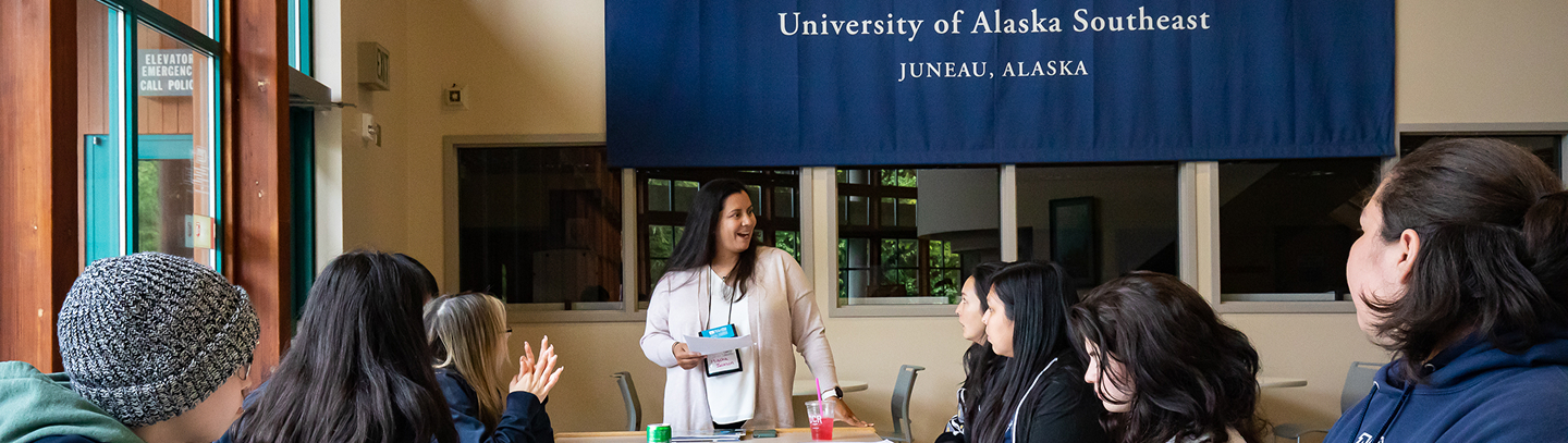 An educator leads a discussion with a group at the University of Alaska Southeast