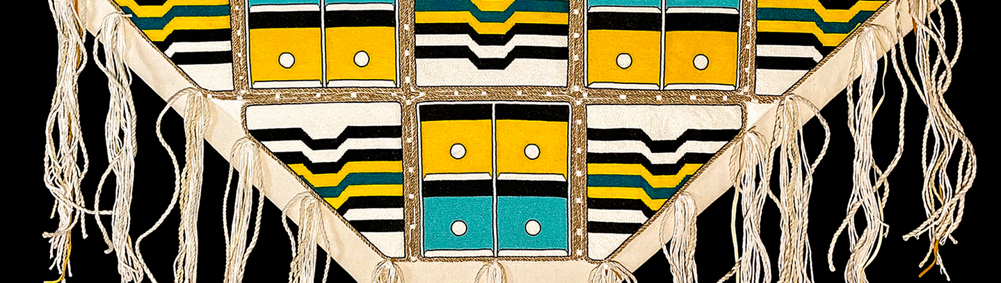 Beaded Northwest Coast textile artwork with white fringe