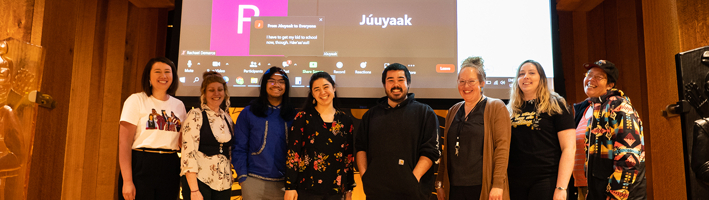 Language scholars and teachers gathered onstage at a language event