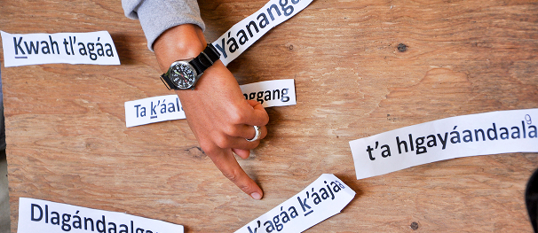 A participant arranging written Indigenous language words during a learning activity