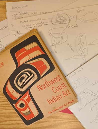 Northwest Coast Indian Art book beside formline design sketches