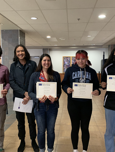 Sealaska scholarship recipients holding their award certificates