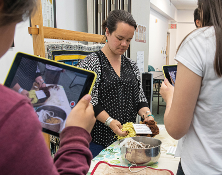 Students record a traditional food demonstration
