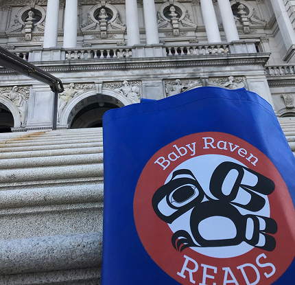 A Baby Raven Reads bag displayed on the steps of the Library of Congress