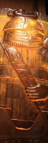 Amber glass house post depicting an Eagle warrior