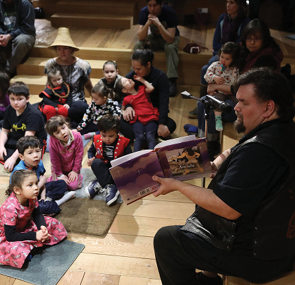 Families listening to a Baby Raven Reads story together