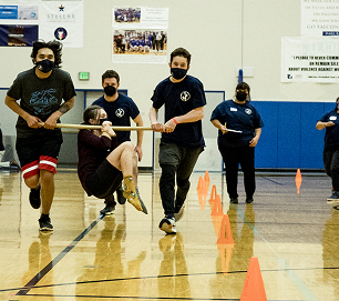Athletes competing together in a Traditional Games team event
