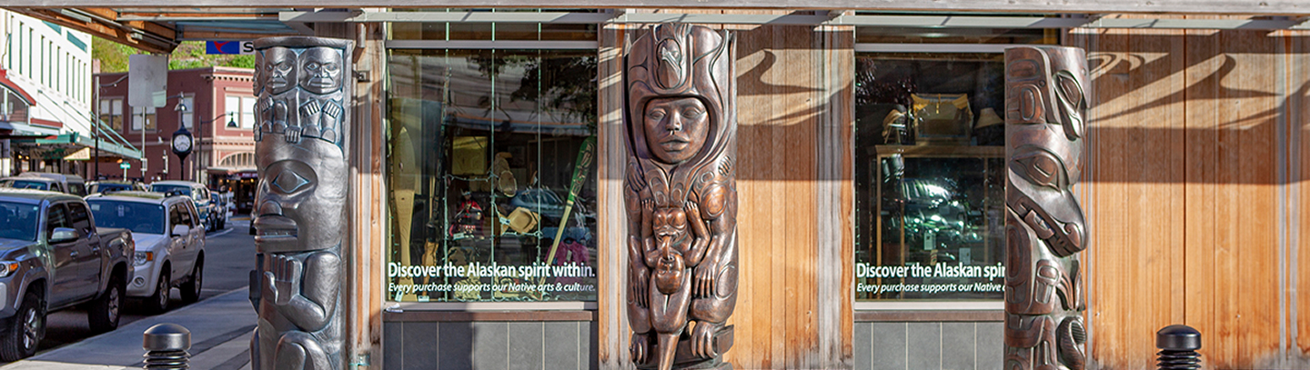 Three bronze house posts outside the Walter Soboleff Building in downtown Juneau