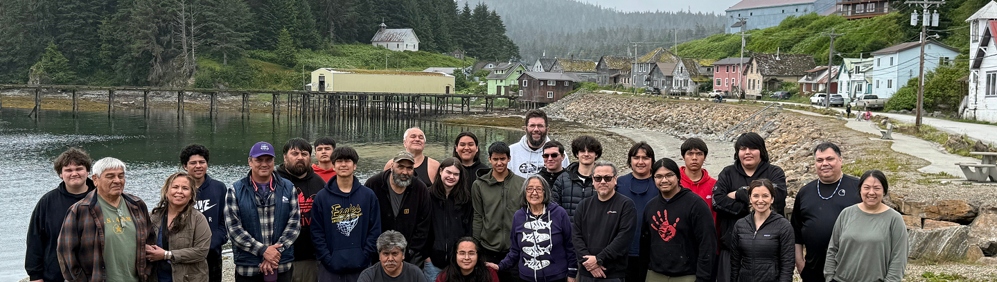 Cultural Warriors participants and mentors gathered on the waterfront in a Southeast Alaska community