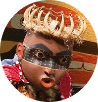 Mask with a crown of antlers and a red collar
