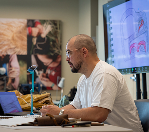 An instructor teaching formline design during Atnané Academy