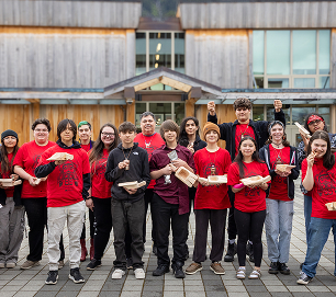 Atnané Academy students gathered with their completed artwork